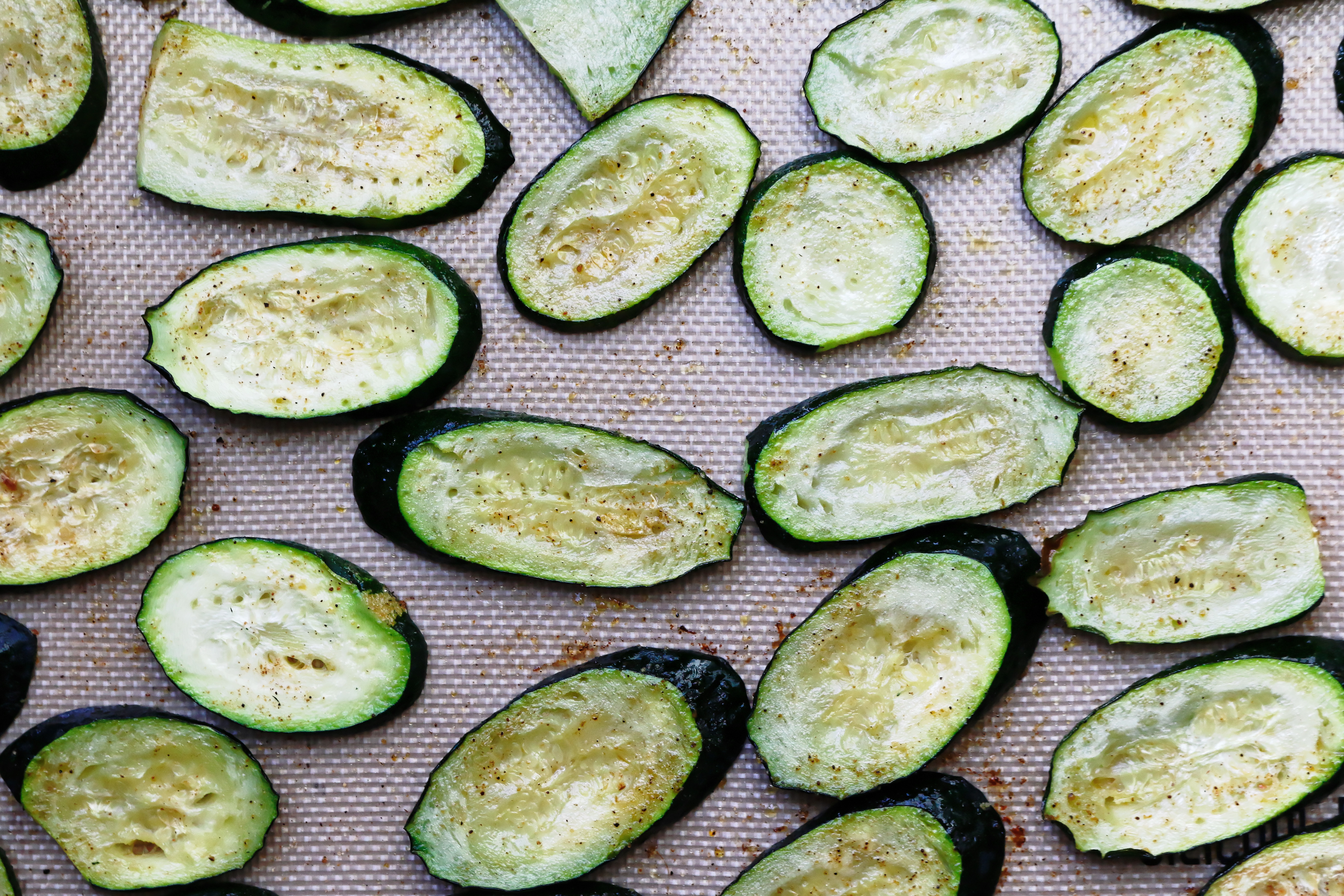 Roasted cooked zucchini on baking sheet