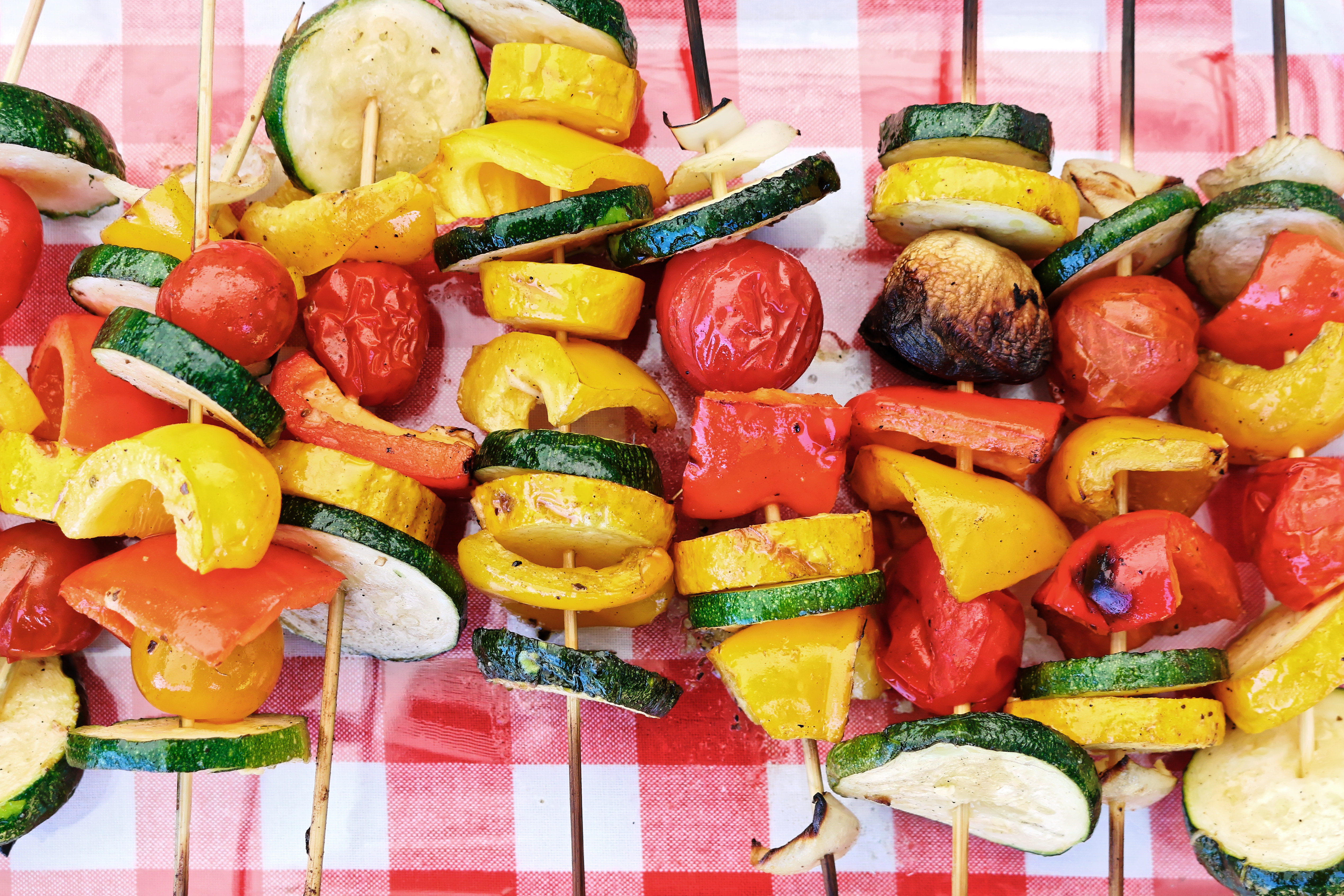 Cooked vegetable vegan gluten free skewer kebab on picnic table