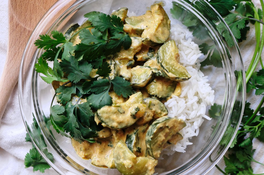 Bowl of zucchini curry served with rice